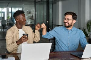 Business Owner Giving Fist Bump to Employee