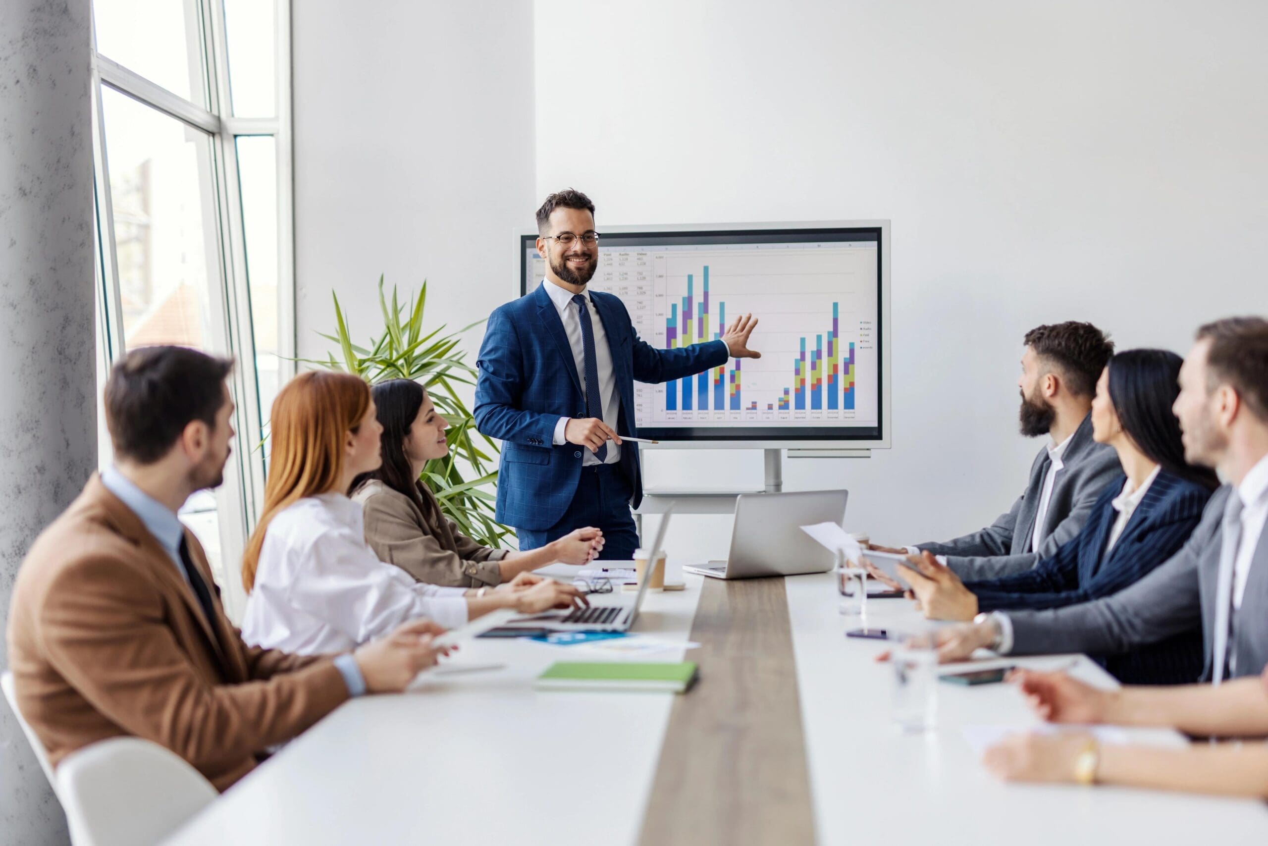 businessman standing explaining strategic planning for businesses