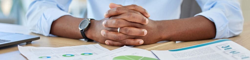 Business owner reviewing cash flow reports with an operational consultant