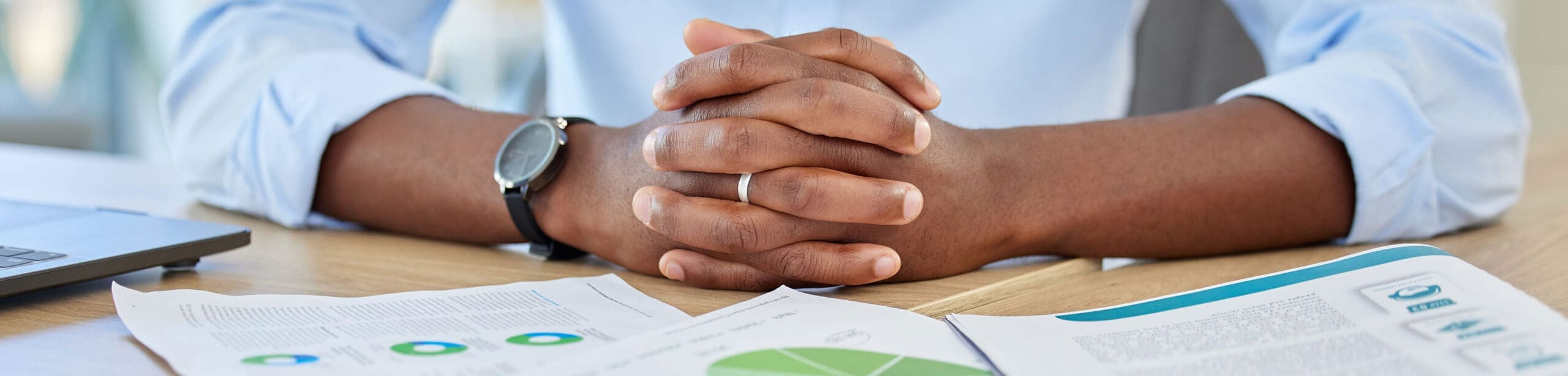 Business owner reviewing cash flow reports with an operational consultant