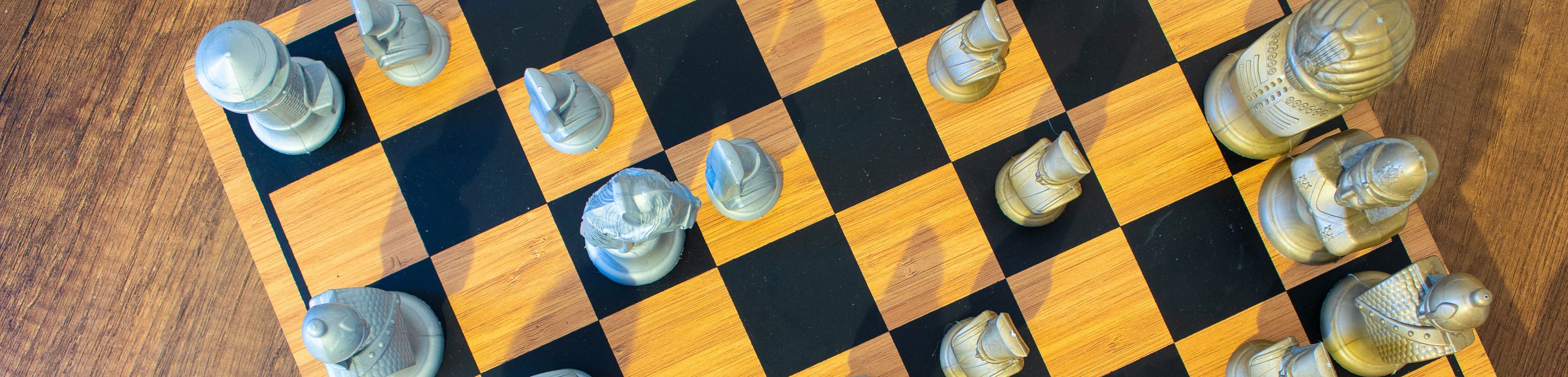 Chess board overhead — strategic business operations and role clarity